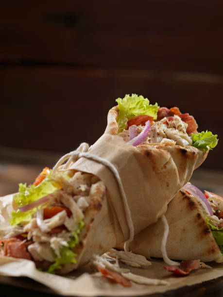 istock Roast Chicken BLT in a Pita Bread Wrap Sandwich 1221822924