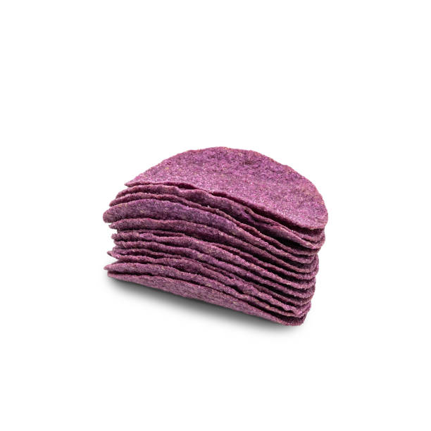 istock Purple Sweet Potato Chips isolated on white background. with clipping paths. 1221824930