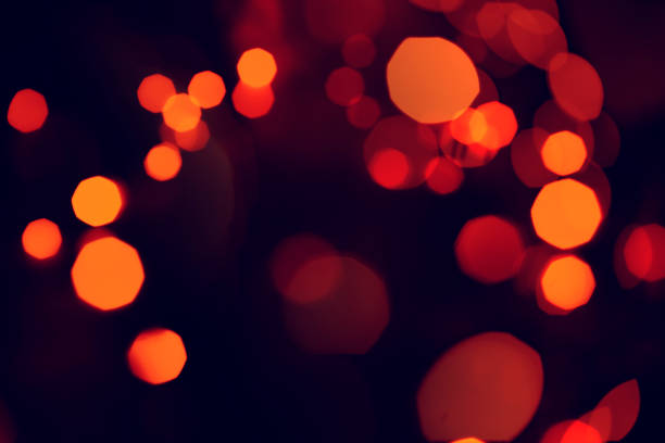 istock Bokeh orange. Orange bright lights with deep dark background. 1221828015