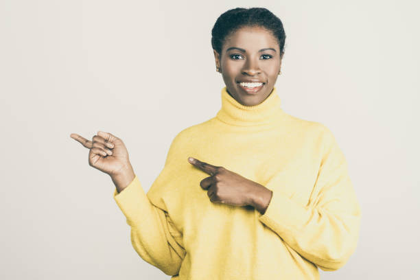 istock Content young woman pointing away 1221828172