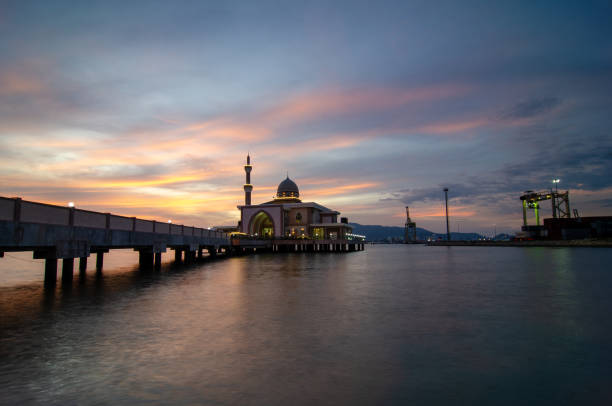 istock Butterworth, Malaysia floating mosque with dramatic sunset cloud 1221833801