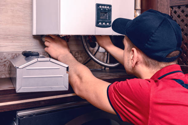 istock A young skilled worker regulates the gas boiler before use. 1221834001