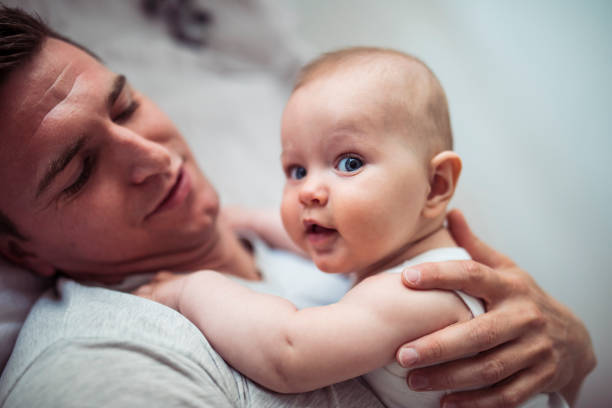 istock Cute little baby and dad 1221834237
