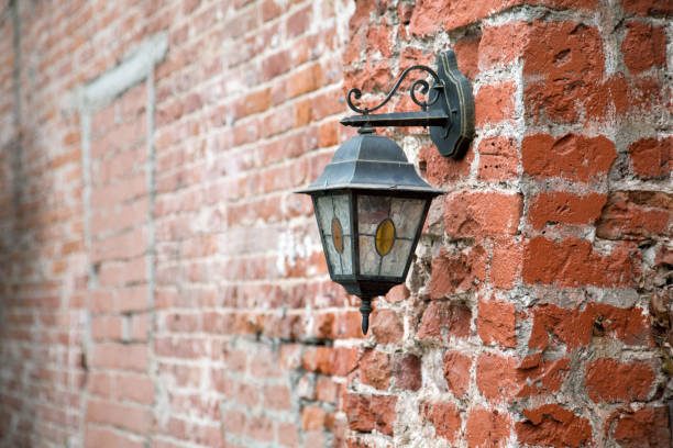 istock vintage lantern on a red brick wall close up 1221837295