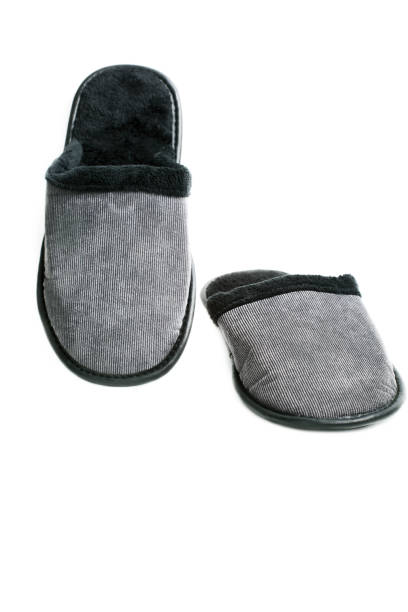 istock gray-black men's slippers isolated on white background 1221837327
