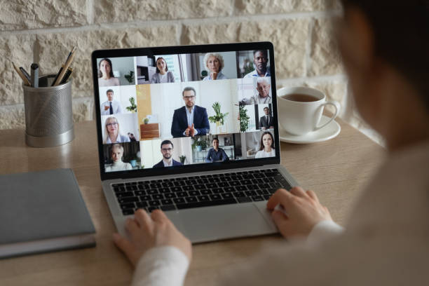 istock Diverse colleagues talk on video call having online briefing 1221837404