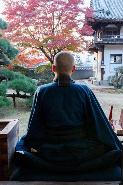 istock Buddhist monks performing zen at autumn temple 1221839088