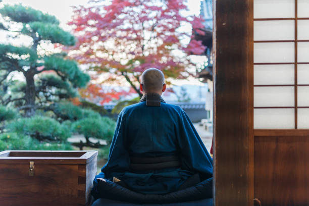 istock Buddhist monks performing zen at autumn temple 1221839089