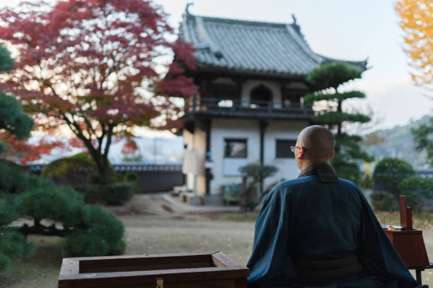 istock Buddhist monks performing zen at autumn temple 1221839094