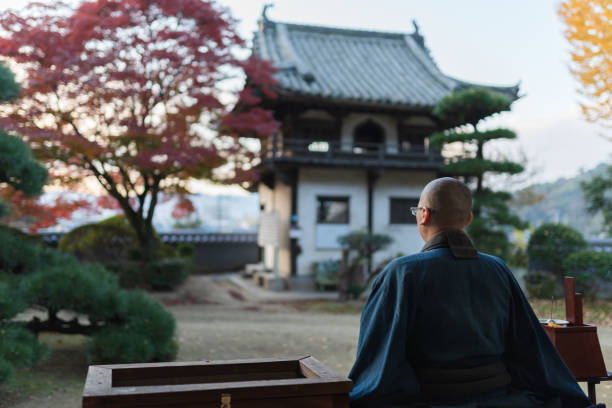 Buddhist monks performing zen at autumn temple Buddhist monks performing zen at autumn temple rinzai zen buddhism stock pictures, royalty-free photos & images