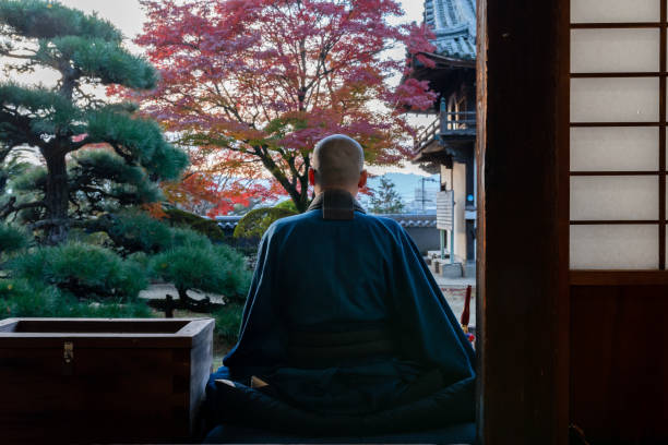 istock Buddhist monks performing zen at autumn temple 1221839110
