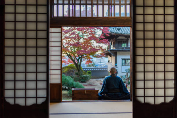 istock Buddhist monks performing zen at autumn temple 1221839133