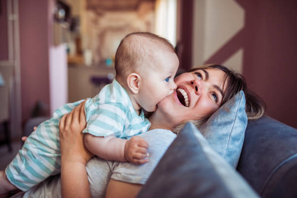 istock Mom and baby having fun at home 1221839592