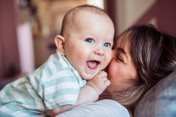 Mom and baby boy having fun