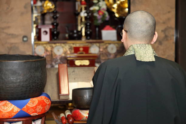 istock Monk praying at the temple 1221841099