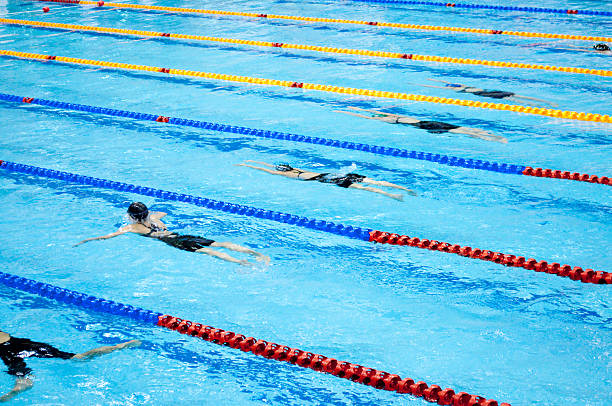 istock swimmers swimming in a pool 122184167