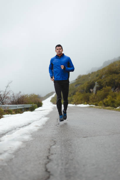 istock Winter running on mountain road 1221843054