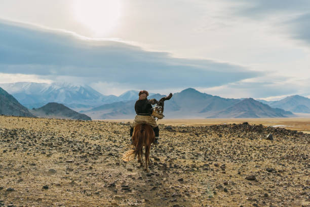 istock Eagle hunter on horse in desert in Mongolia 1221845397