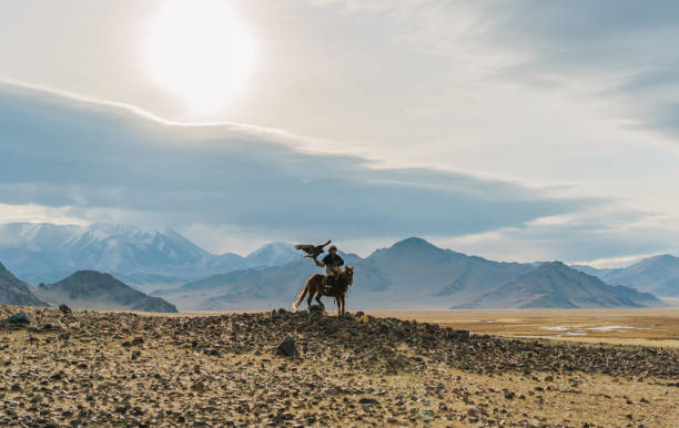 istock Eagle hunter on horse in desert in Mongolia 1221845442