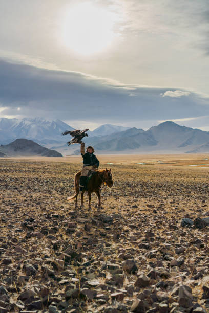 istock Eagle hunter on horse in desert in Mongolia 1221845446