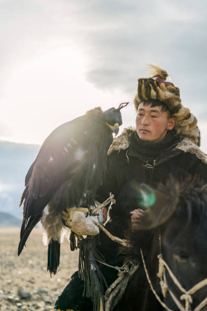 istock Portrait of eagle hunter near the river in Mongolia 1221845480
