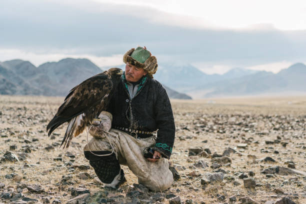 istock Portrait of eagle hunter in desert   in Mongolia 1221845525