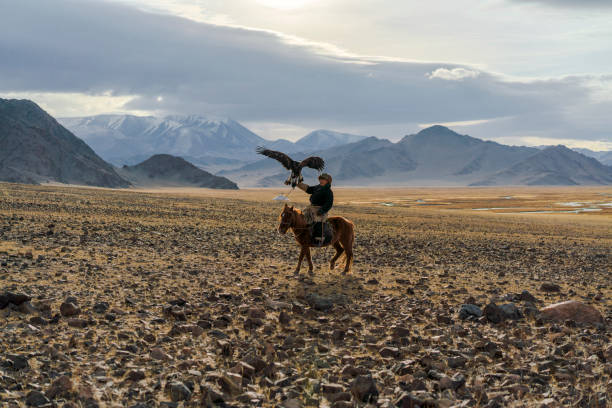 istock Eagle hunter on horse in desert in Mongolia 1221845603