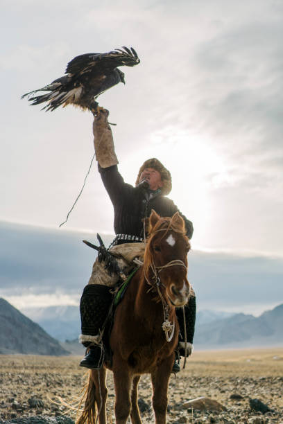 istock Eagle hunter on horse in desert in Mongolia 1221845609