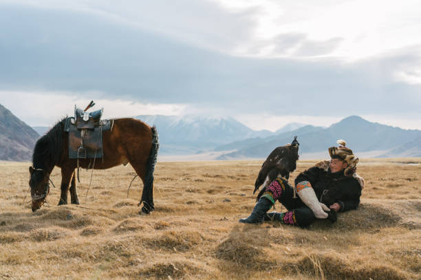 istock Portrait of eagle hunter near the river  in Mongolia 1221845656