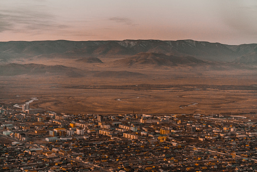Scenic  aerial view of  town in Gobi desert at sunset