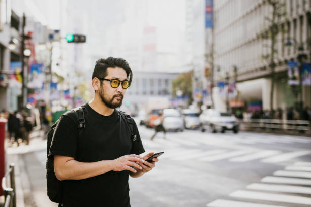 istock Asian Man waiting for his Driver 1221846016