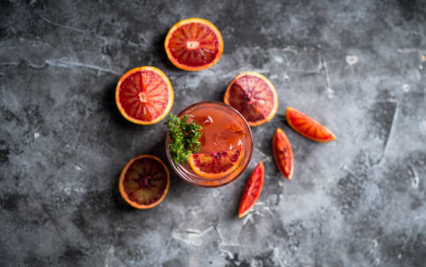 istock Old-fashioned cocktail with blood oranges and thyme on the rustic background 1221846602