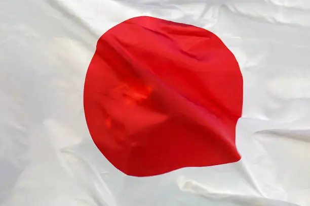 Photo of Flag of Japan. Flag of Japan waving in the wind.