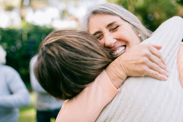 istock Senior mother embracing daughter 1221847683