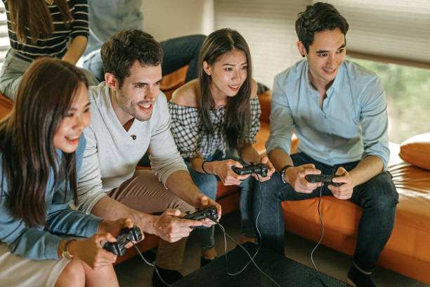 istock Friends playing video game at home 1221848087