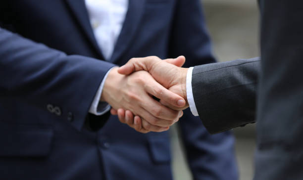 istock Cropped Image Of Business People Shaking Hands 1221849691