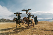 istock Portrait of group of eagle hunters near the river in Mongolia 1221850805