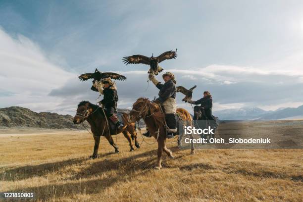 Portrait Of Group Of Eagle Hunters Near The River In Mongolia Stock Photo - Download Image Now