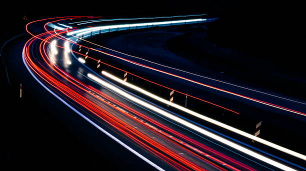 istock lights of cars with night 1221854477
