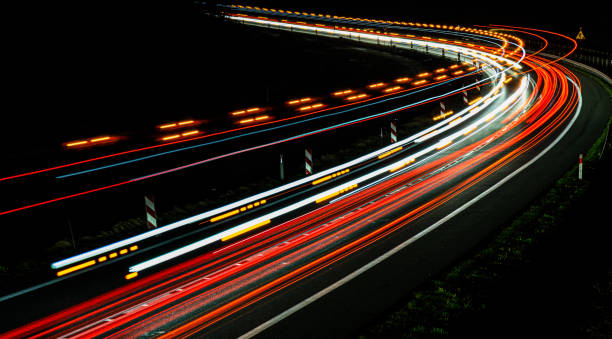 istock lights of cars with night 1221854483