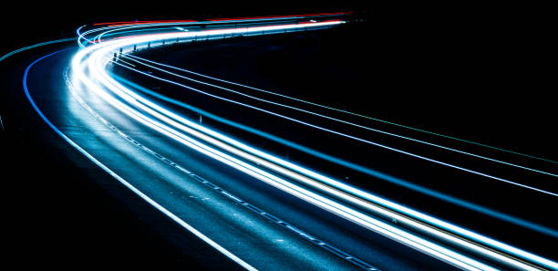 istock lights of cars with night 1221854491