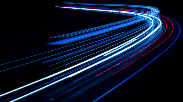 istock lights of cars with night 1221854504