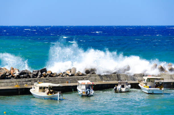 Greek bay. Greek coast. The waves. Breeze. Rocky shore.
