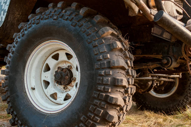 istock big wheel with high tread on wet grass 1221856404