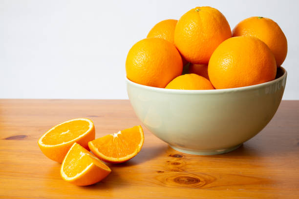 istock Big bowl with bright oranges 1221858386