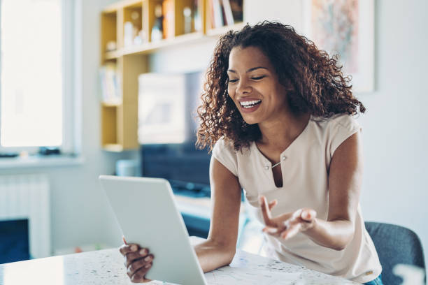 istock Young woman using digital tablet for a video call 1221858913