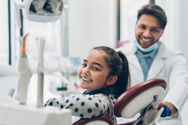 istock Smiling girl in the dentist's office 1221858931