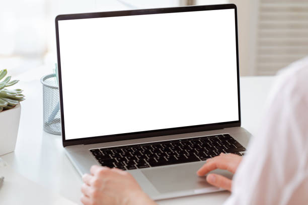 Workplace with laptop at home on window background.
