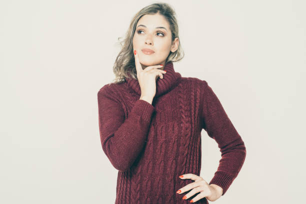 istock Pensive young woman looking aside 1221860212