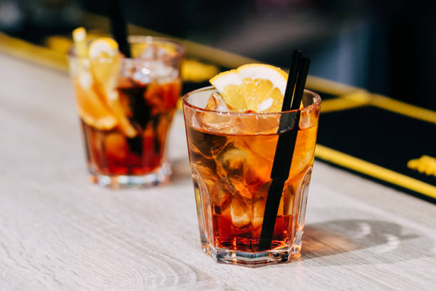 istock Two glasses of whiskey with lemon 1221860355